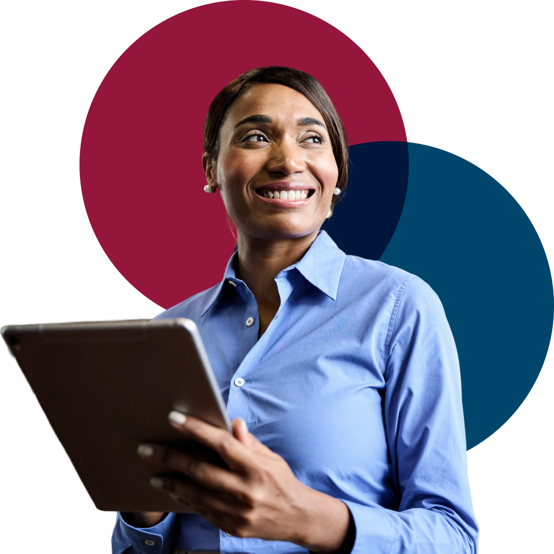 Small business owner screening candidates on a laptop. Aligned at the bottom of the hero section so it sits on top of the next section.
